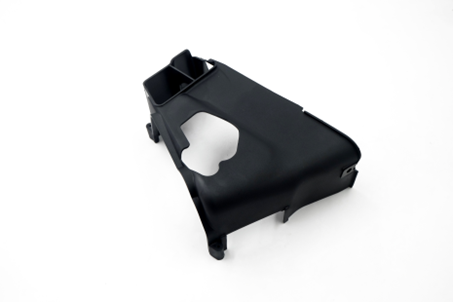 An injection-moulded plastic cover, photographed against a plain background